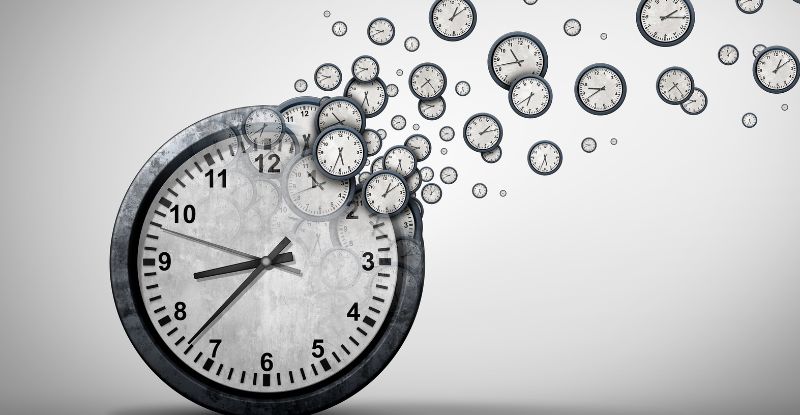 An illustration of a clock with more small clocks floating away from it to indicate the passage of time.